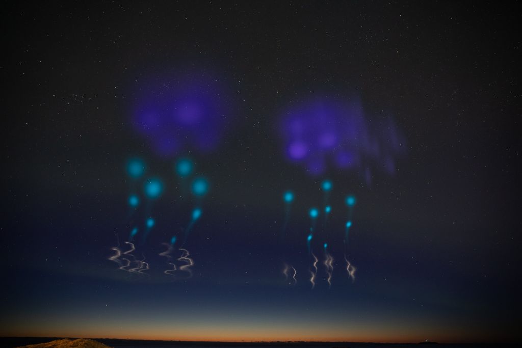 Rockets leave a trail of light that looks like living water in the sky